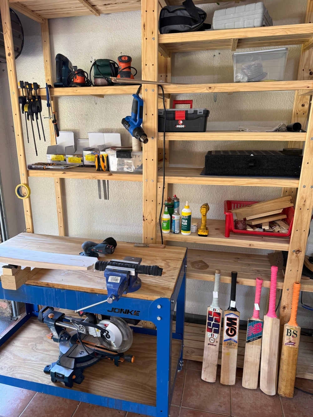 Liam's 2nd Innings workshop with cricket bats, machinery, clamps and repair tools