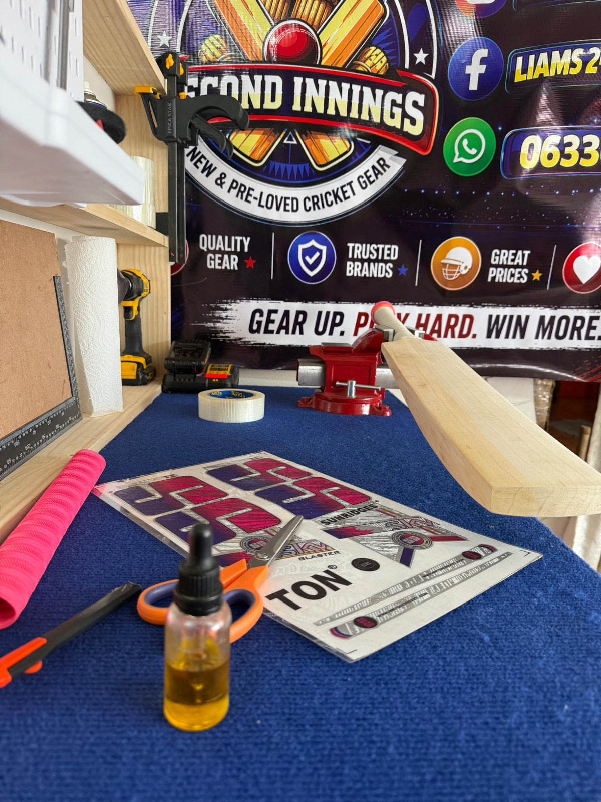 Close view of a cricket bat, grip and finishing materials on Liam's 2nd Innings service bench
