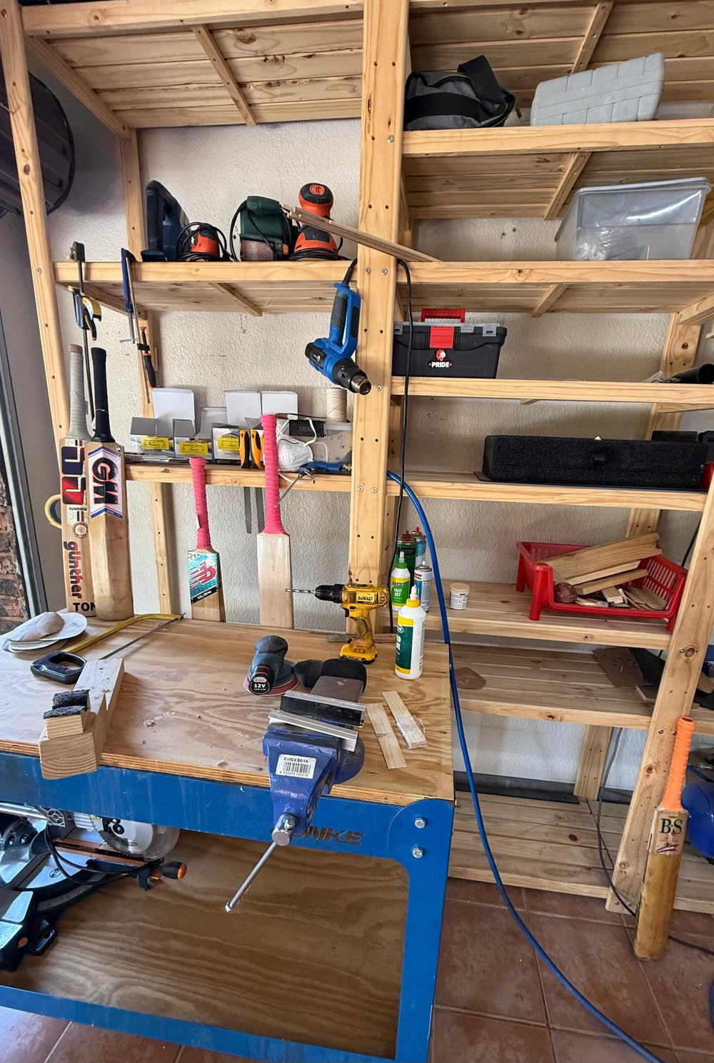 Full view of Liam's 2nd Innings cricket bat workshop with tools, shelving and repair bench