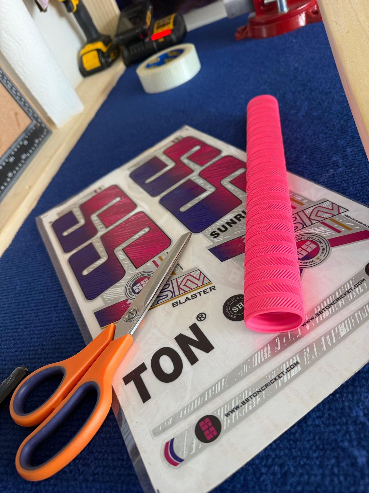 Pink cricket bat grip, replacement stickers and workshop scissors at Liam's 2nd Innings