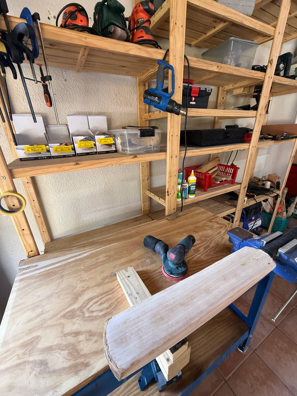Cricket bat being sanded and restored on Liam's 2nd Innings workshop bench