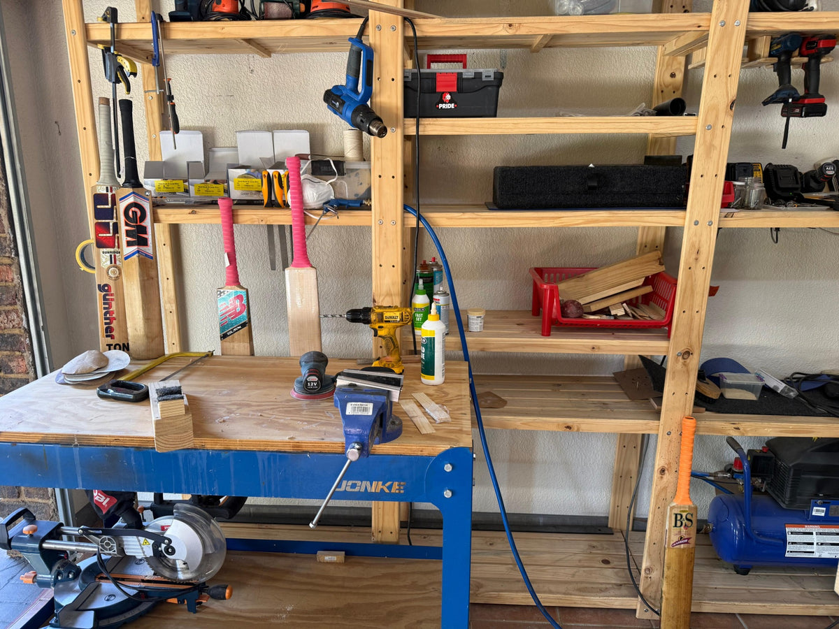 Wide Liam's 2nd Innings workshop view with repair bench, machinery and cricket bats